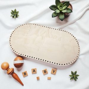 A 75×40 cm oval wooden crochet base with evenly spaced holes, designed to fit Three Little Cubs crochet bassinet and Moses basket patterns.